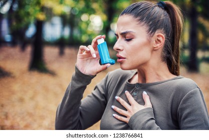 Woman Using Asthma Inhaler