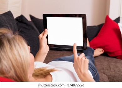 Woman using blank screen tablet 