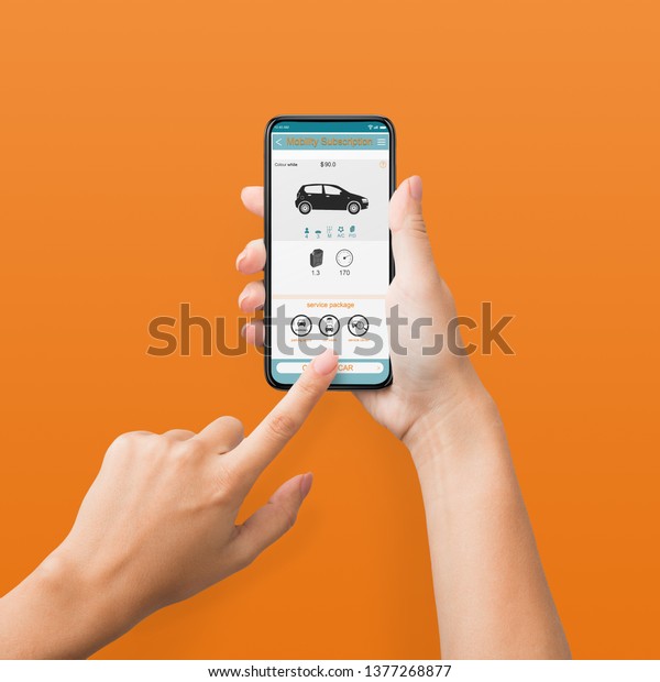 Woman using cellphone with car rent app on screen,\
orange background, pov