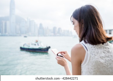 Woman Using Cellphone At Hong Kong City