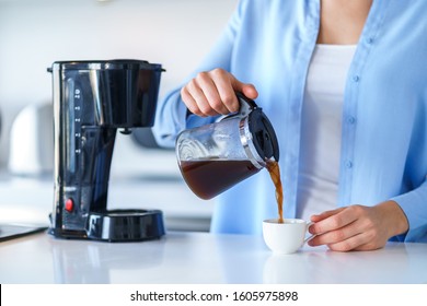 Woman Using Coffee Maker For Making And Brewing Coffee At Home. Coffee Blender And Household Kitchen Appliances For Makes Hot Drinks