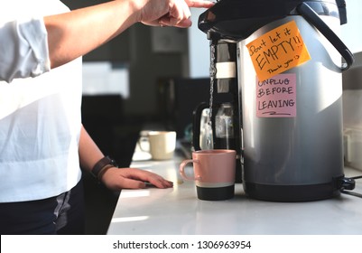 Woman Using A Coffeemaker