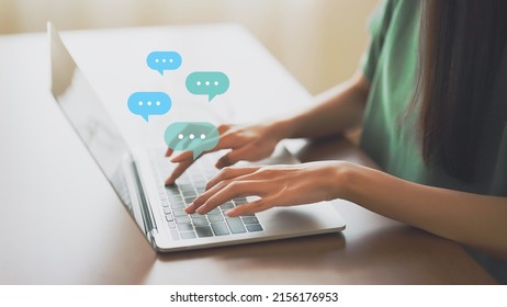 Woman using computer laptop on wood desk. Online message live chat chatting on application communication digital media website and social network - Shutterstock ID 2156176953