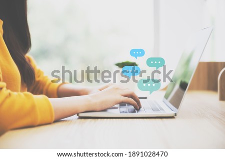 Woman using computer laptop on wood desk. Online live chat chatting on application communication digital media website and social network