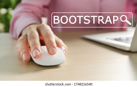 Woman Using Computer Mouse With Laptop At Table, Closeup. Bootstrap Button