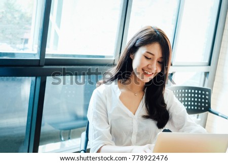Woman using computer in office