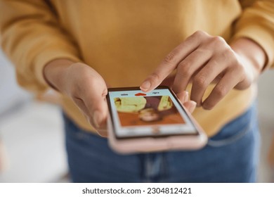 Woman using dating app, swiping and liking photos of users. Close up shot of female hands using smartphone to find love, partner or boyfriend. Find love online concept - Powered by Shutterstock