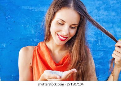 Woman Using Dry Shampoo On Her Hair