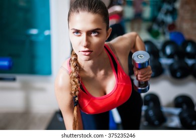 Woman using dumbbell
