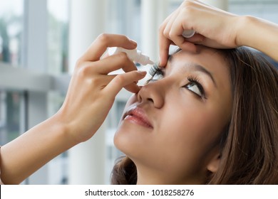 Woman Using Eye Drop, Woman Dropping Eye Lubricant To Treat Dry Eye Or Allergy; Sick Asian Girl Treating Eyeball Irritation Or Inflammation; Sick Woman Suffering From Irritated Eye, Optical Symptoms