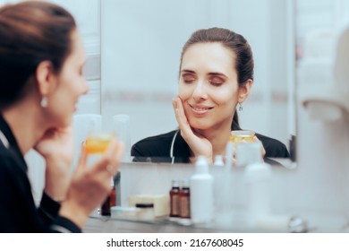 
Woman Using Face Cream During Nighttime Skin Routine. Lady With Mature Complexion Applying Cosmetic Product
