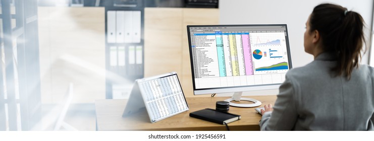 Woman Using Finance Spreadsheet Report On Laptop Screen