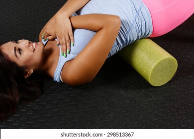 Woman using a foam roller after a workout