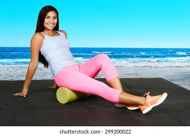 Woman Using A Foam Roller After A Workout