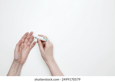 Woman using glucometer for testing level Blood sugar. Top view. Copy space