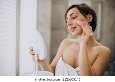 Woman Using Gua Sha Stone At Spa