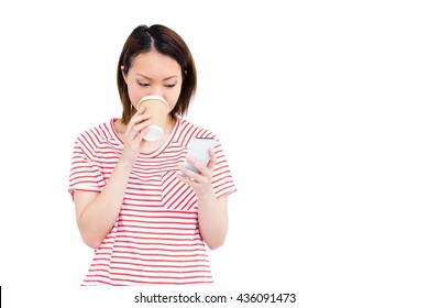 Woman Using Her Mobile Phone While Drinking Coffee On White Background