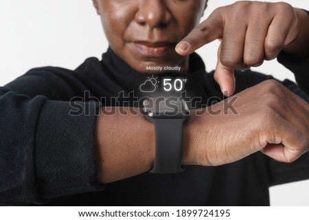 Woman using holography from smartwatch wearable technology