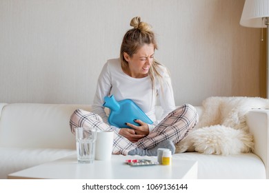 Woman Using Hot Water Bottle