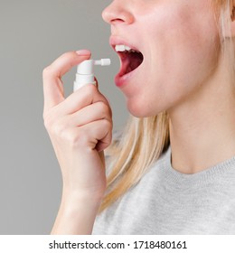 Woman Using Inhaler Mouth Spray For Fresh Breath