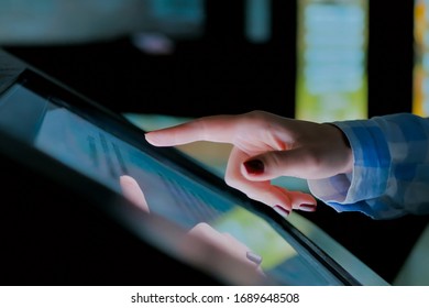 Woman Using Interactive Touchscreen Display Of Electronic Multimedia Kiosk At Modern History Museum. Education, Learning And Technology Concept