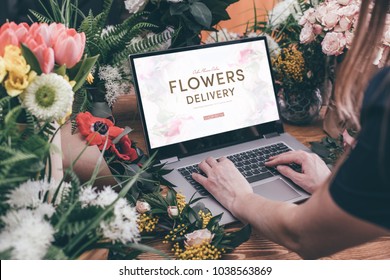 Woman Using Interface Of Online Flower Shop