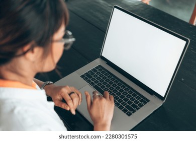 woman using laptop. Blank screen laptop for presentation media of business.Working at home.
