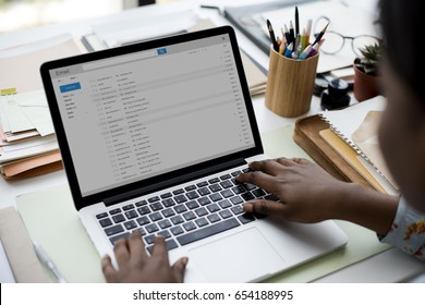 Woman using laptop for checking email - Shutterstock ID 654188995