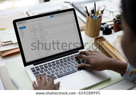 Woman using laptop for checking email