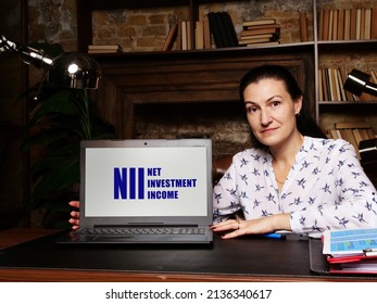 Woman Using Laptop Computer With  NII NET INVESTMENT INCOME Icon On Screen Background, Success In Business Concept
