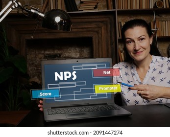 Woman Using Laptop Computer With  NPS Net Promoter Score Icon On Screen Background, Success In Business Concept
