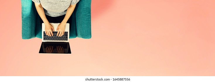 Woman Using A Laptop Computer Overhead View