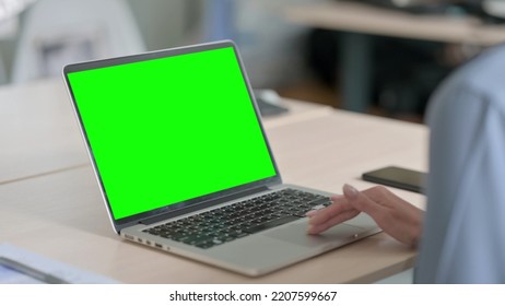 Woman Using Laptop With Green Chroma Key Screen