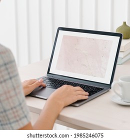 Woman using a laptop mockup