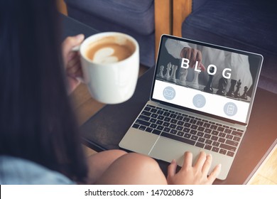 Woman Using Laptop, Woman Reading Blog Online On Computer At Coffee Shop.