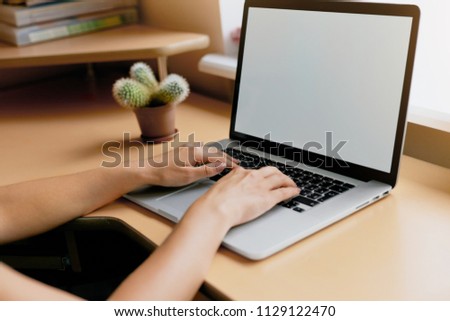 woman using laptop, searching web, browsing information, having workplace at home. Vintage concept