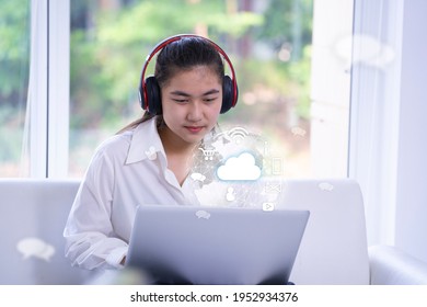 Woman using laptop with Smart services icons, concept of internet of things, new technology big data and business process strategy, customer service, cloud computing, learning online. - Powered by Shutterstock