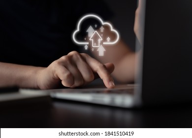 Woman Using Laptop For Upload With Cloud Icon Hologram Effect.