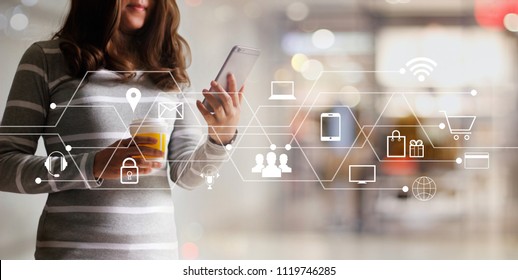 Woman using mobile payments online shopping and icon customer network connection. Digital marketing, m-banking and omni channel.