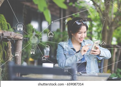 Woman using mobile payments online shopping and icon customer network connection on screen, m-banking and connecting with omni channel vendor. Internet of thing, Multi-channel or Omni channel concept.