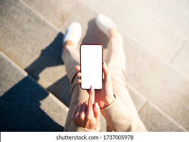 Woman using mobile phone in the city, screen mockup for your app design