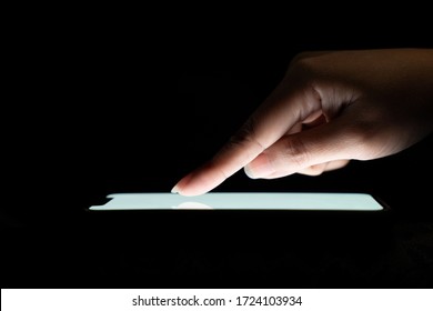 Woman using mobile phone in dark room, blank screen for graphic montage
Infographic editing for advertising
Use your index finger to touch the screen. white screen surf online social media 