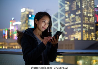 Woman Using Mobile Phone In Hong Kong