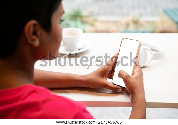 Woman\
using mobile phone, reading text message, check email, working\
online sitting in cafe. Female making reservation, shopping online,\
looking at digital screen. Selective focus, mockup\
