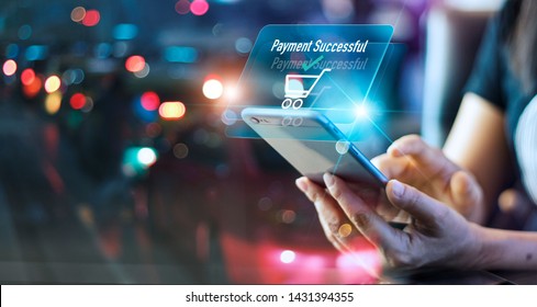 Woman using mobile smart phone, online payment, banking and online shopping in the night light colorful background - Shutterstock ID 1431394355