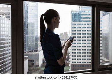 Woman using mobile smart phone - Powered by Shutterstock