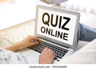 Woman Using Modern Laptop For Taking Quiz Online At Home, Closeup