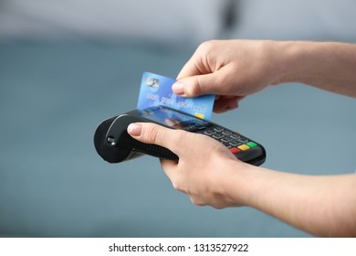 Woman using modern payment terminal indoors, closeup - Shutterstock ID 1313527922