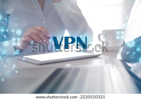 Woman using modern tablet with switched on VPN in office, closeup