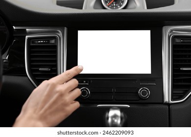 Woman using navigation system while driving her car, closeup